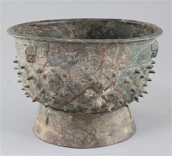 A Chinese archaic bronze ritual food vessel, Yu, Shang dynasty, Anyang type, 17cm high, 25.5cm diameter, crack